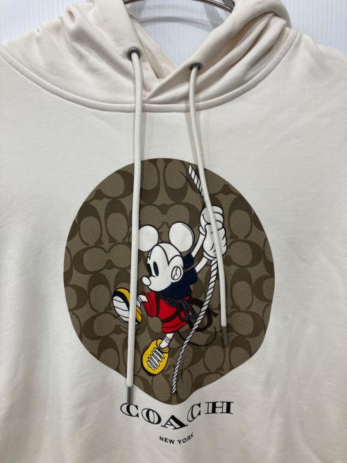 COACH（コーチ）COACH (コーチ) Disney (ディズニー) コラボシグネチャープルオーバーパーカー アイボリー サイズ:Lの古着・服飾アイテム
