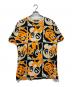 MCM（エムシーエム）の古着「総柄Tシャツ」｜ベージュ×オレンジ