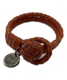 BOTTEGA VENETA（ボッテガベネタ）の古着「イントレチャートレザー ブレスレット」｜オレンジ