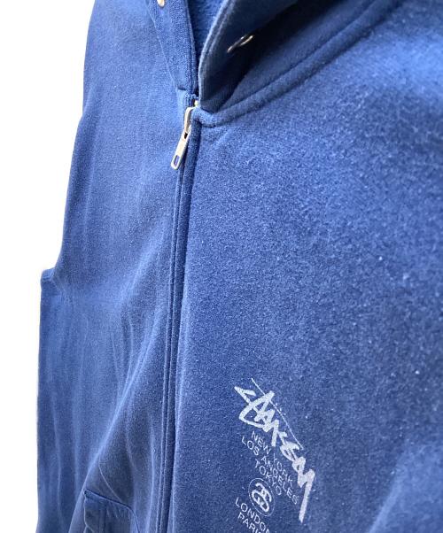 stussy（ステューシー）stussy (ステューシー) ワールドツアーフルジップアップパーカー ネイビー サイズ:XLの古着・服飾アイテム