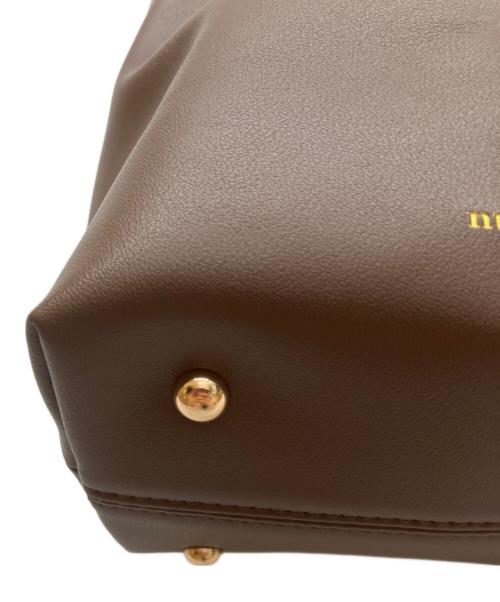 NUNELA（ヌネラ）NUNELA (ヌネラ) デザインハンドバッグ ブラウンの古着・服飾アイテム