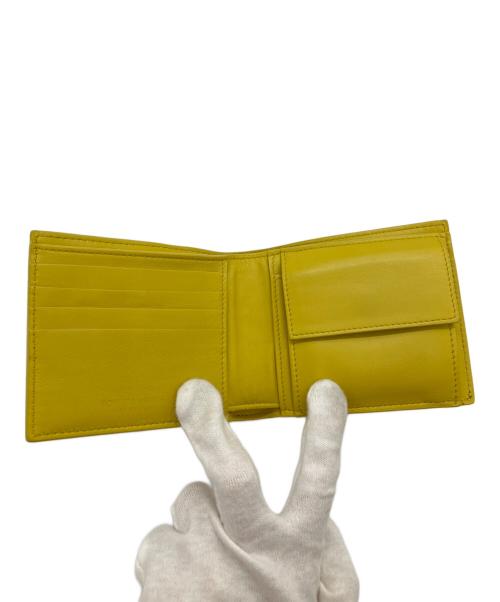 BOTTEGA VENETA（ボッテガベネタ）BOTTEGA VENETA (ボッテガベネタ) デボスイントレチャート2つ折り財布 イエローの古着・服飾アイテム