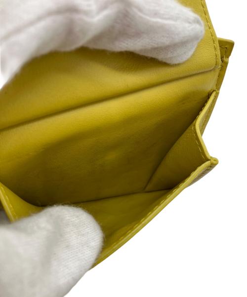BOTTEGA VENETA（ボッテガベネタ）BOTTEGA VENETA (ボッテガベネタ) デボスイントレチャート2つ折り財布 イエローの古着・服飾アイテム