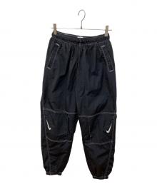 NIKE（ナイキ）の古着「スウッシュ ウーブン パンツ」｜ブラック