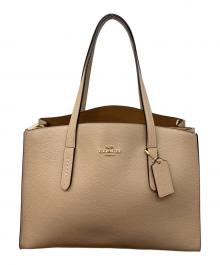 COACH（コーチ）の古着「チャーリー キャリーオール」｜ベージュ