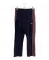 Needles（ニードルズ）の古着「Narrow Track Pant - C/PE Velour ベロアナロートラックパンツ」｜ネイビー