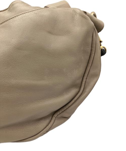 Vivienne Westwood（ヴィヴィアンウエストウッド）Vivienne Westwood (ヴィヴィアンウエストウッド) オーブ型押しタッセルレザートートバッグ ベージュ×ネイビー サイズ:下記参照の古着・服飾アイテム