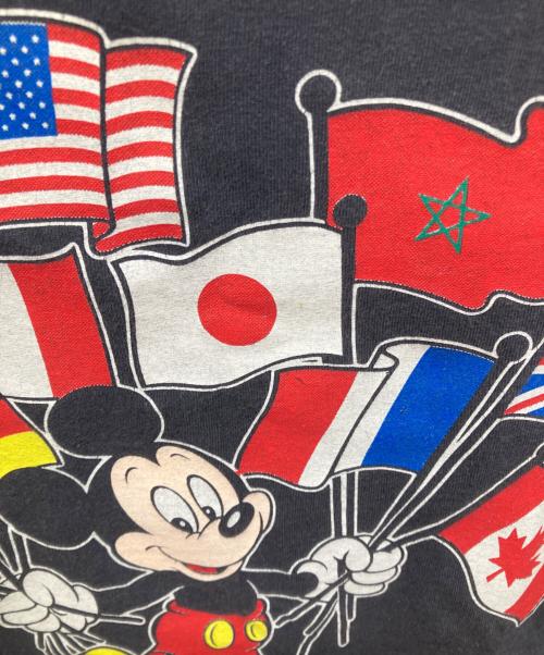 DISNEY（ディズニー）Disney (ディズニー) USA製 万国旗ミッキープリントTシャツ ブラック サイズ:SMALLの古着・服飾アイテム
