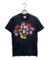 Disney（ディズニー）の古着「USA製 万国旗ミッキープリントTシャツ」｜ブラック