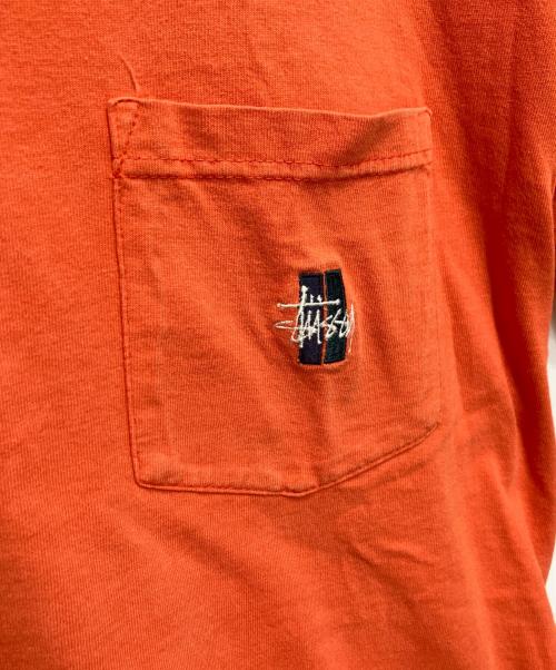 OLD STUSSY（オールドステューシー）OLD STUSSY (オールドステューシー) ポケットTシャツ オレンジ サイズ:Mの古着・服飾アイテム