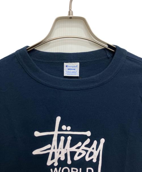 Champion（チャンピオン）Champion (チャンピオン) stussy (ステューシー) World Tour Tee （ワールド ツアー ティー） ブルー サイズ:Mの古着・服飾アイテム