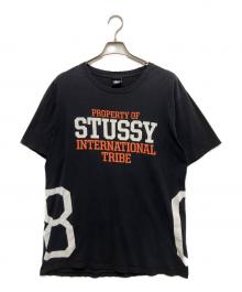 stussy（ステューシー）の古着「INTER NATIONAL TRIBE Tシャツ（インターナショナルトゥライブ Tシャツ）」｜ブラック