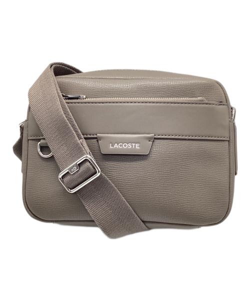 LACOSTE（ラコステ）LACOSTE (ラコステ) オシアン レザーレポーターバッグ ベージュの古着・服飾アイテム