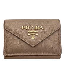 PRADA（プラダ）の古着「サフィアーノコンパクトウォレット」｜ベージュ