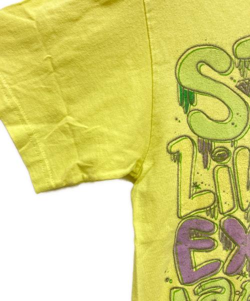 stussy（ステューシー）stussy (ステューシー) 恐竜 プリントTシャツ イエロー サイズ:Mの古着・服飾アイテム