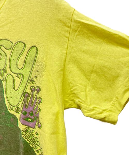 stussy（ステューシー）stussy (ステューシー) 恐竜 プリントTシャツ イエロー サイズ:Mの古着・服飾アイテム