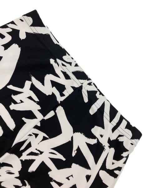 COMME des GARCONS（コムデギャルソン）COMME des GARCONS (コムデギャルソン) グラフィティプリントストレッチレギンスパンツ ブラック×ホワイト サイズ:Sの古着・服飾アイテム