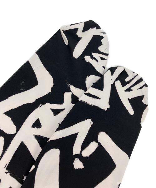 COMME des GARCONS（コムデギャルソン）COMME des GARCONS (コムデギャルソン) グラフィティプリントストレッチレギンスパンツ ブラック×ホワイト サイズ:Sの古着・服飾アイテム