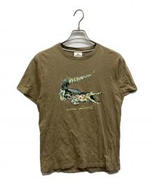 LACOSTE（ラコステ）の古着「LACOSTE デカワニプリントTシャツ」｜ブラウン