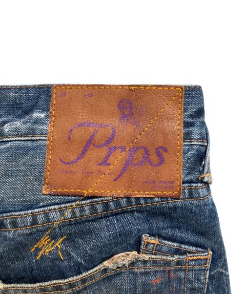 PRPS（ピーアルピーエス）PRPS (ピーアルピーエス) 紫製品  ペンキ加工デニムパンツ インディゴ サイズ:W28の古着・服飾アイテム