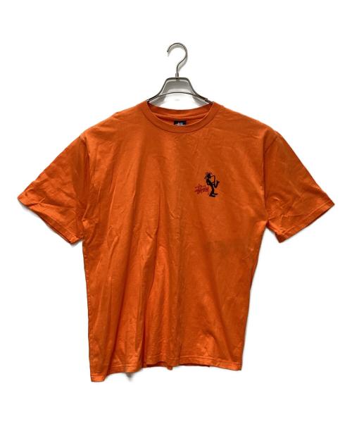 stussy（ステューシー）stussy (ステューシー) JAZZ SHADOW MAN T-SHIRT オレンジ サイズ:LARGEの古着・服飾アイテム