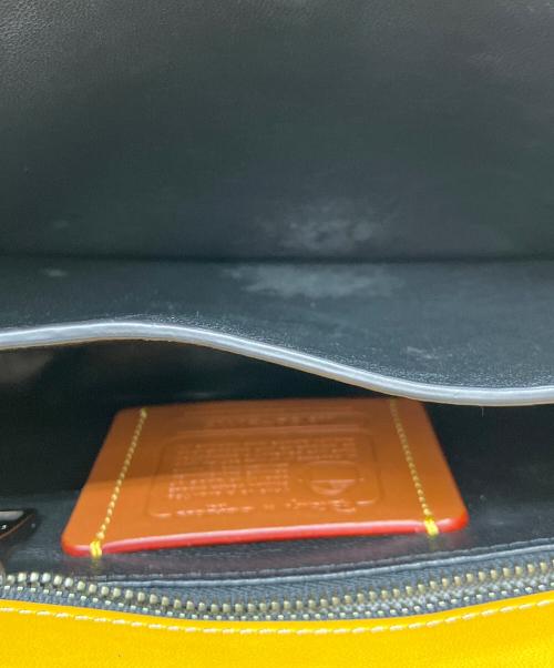 COACH（コーチ）COACH (コーチ) DISNEY (ディズニー) フラップショルダーバッグ イエローの古着・服飾アイテム
