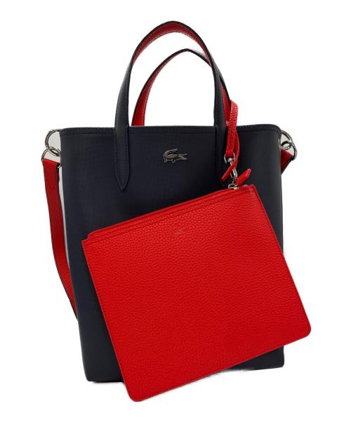 LACOSTE（ラコステ）LACOSTE (ラコステ) ANNAリバーシブル縦型 トートバッグ ネイビー×レッドの古着・服飾アイテム