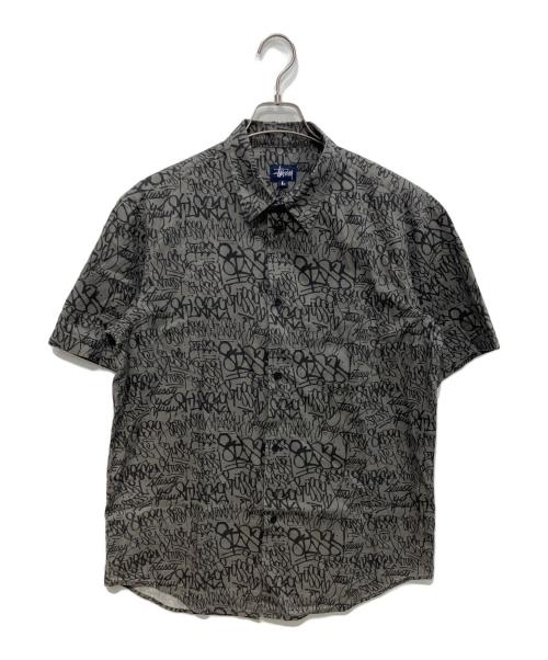 stussy（ステューシー）stussy (ステューシー) 90sグラフィックプリントシャツ  OLD   USA製 紺タグ グレー サイズ:Lの古着・服飾アイテム