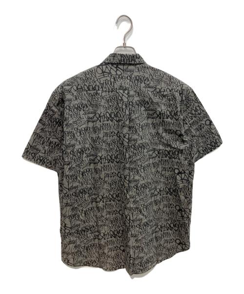 stussy（ステューシー）stussy (ステューシー) 90sグラフィックプリントシャツ  OLD   USA製 紺タグ グレー サイズ:Lの古着・服飾アイテム