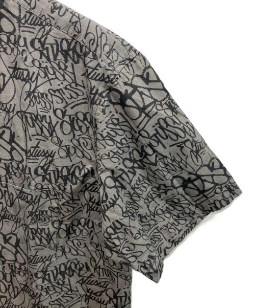 stussy（ステューシー）stussy (ステューシー) 90sグラフィックプリントシャツ  OLD   USA製 紺タグ グレー サイズ:Lの古着・服飾アイテム