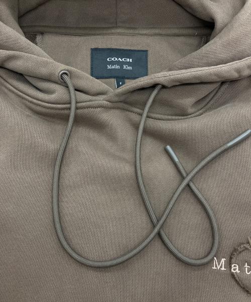COACH（コーチ）COACH (コーチ) Matin Kim (マーティン キム) プルオーバーパーカー ブラウン サイズ:Freeの古着・服飾アイテム