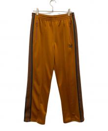 Needles（ニードルズ）の古着「BOOTCUT TRACK PANT」｜オレンジ