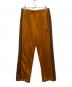 Needles（ニードルズ）の古着「BOOTCUT TRACK PANT」｜オレンジ