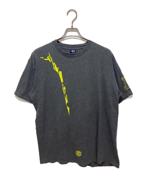 stussy（ステューシー）stussy (ステューシー) NEXUSVII (ネクサスセブン) コラボTシャツ グレー サイズ:Lの古着・服飾アイテム