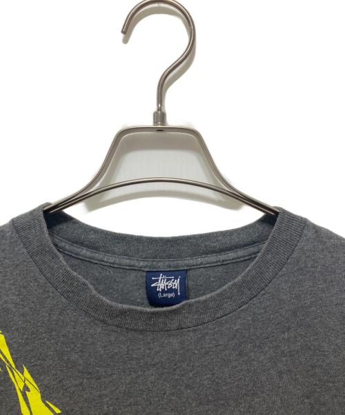 stussy（ステューシー）stussy (ステューシー) NEXUSVII (ネクサスセブン) コラボTシャツ グレー サイズ:Lの古着・服飾アイテム