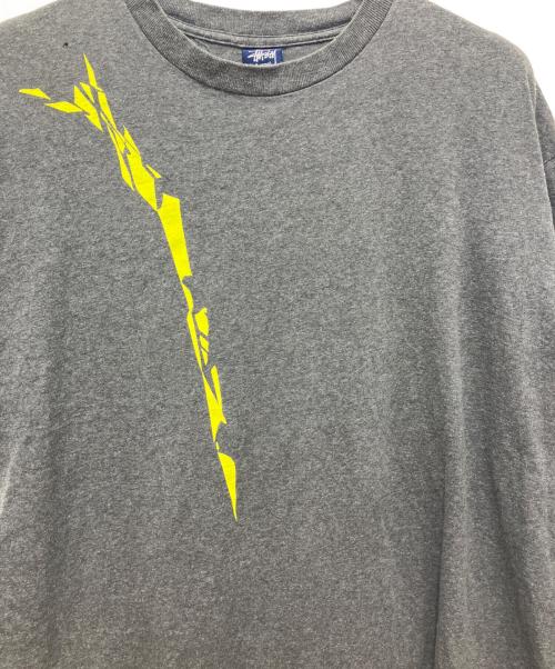 stussy（ステューシー）stussy (ステューシー) NEXUSVII (ネクサスセブン) コラボTシャツ グレー サイズ:Lの古着・服飾アイテム