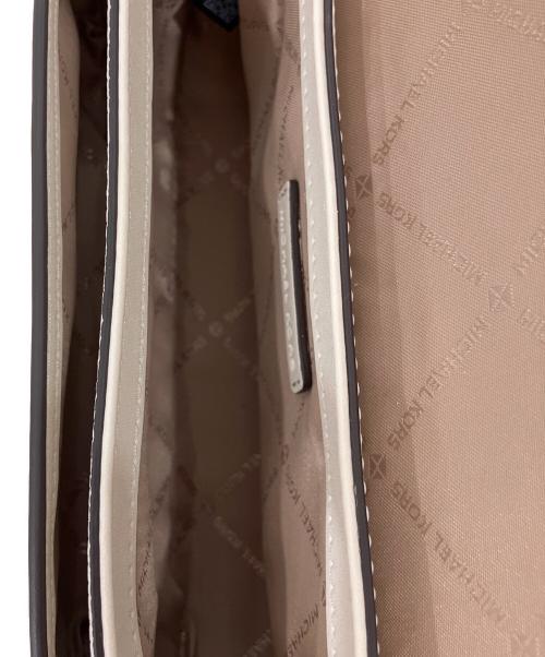 MICHAEL KORS（マイケルコース）MICHAEL KORS (マイケルコース) Jet Set Travel Small Pebbled Leather Crossbody Bag アイボリー 未使用品の古着・服飾アイテム