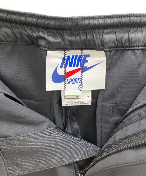 NIKE（ナイキ）NIKE (ナイキ) sacai (サカイ) ロゴ刺繍トラックパンツ ブラック サイズ:Mの古着・服飾アイテム