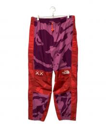THE NORTH FACE×KAWS（ザ ノース フェイス×カウズ）の古着「トラックパンツ」｜ピンク×パープル