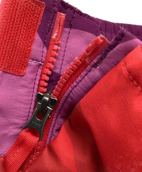 THE NORTH FACE（ザ ノース フェイス）THE NORTH FACE (ザ ノース フェイス) KAWS (カウズ) トラックパンツ ピンク×パープル サイズ:Lの古着・服飾アイテム