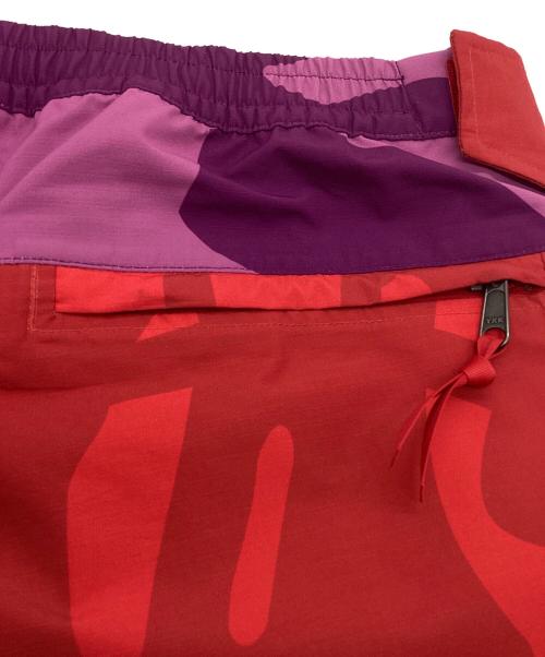 THE NORTH FACE（ザ ノース フェイス）THE NORTH FACE (ザ ノース フェイス) KAWS (カウズ) トラックパンツ ピンク×パープル サイズ:Lの古着・服飾アイテム