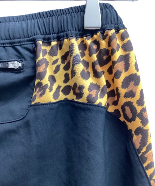 MIOUNTAIN MARTIAL ARTS（マウンテンマーシャルアーツ）MIOUNTAIN MARTIAL ARTS (マウンテンマーシャルアーツ) MMAサイドグラフィックランショーツ（トレッキングボトム) ブラックxオレンジ サイズ:Sの古着・服飾アイテム