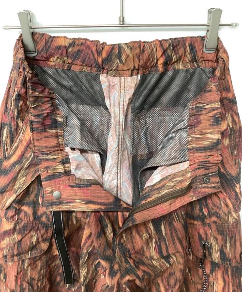 and wander（アンドワンダー）and wander (アンドワンダー) printed ripstop cargo pants レッド サイズ:Lの古着・服飾アイテム