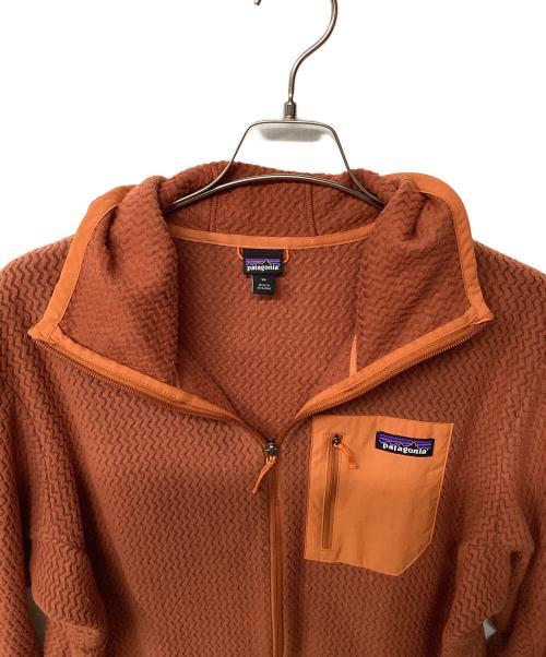 Patagonia（パタゴニア）Patagonia (パタゴニア) R1エア・フルジップ・フーディ（トレッキングウェア) オレンジ サイズ:XLの古着・服飾アイテム