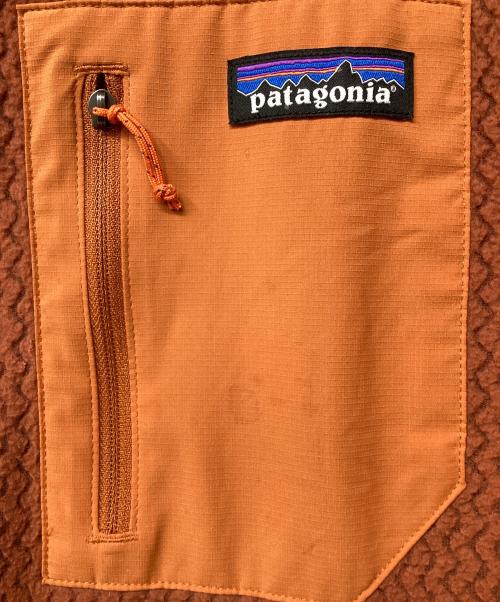 Patagonia（パタゴニア）Patagonia (パタゴニア) R1エア・フルジップ・フーディ（トレッキングウェア) オレンジ サイズ:XLの古着・服飾アイテム
