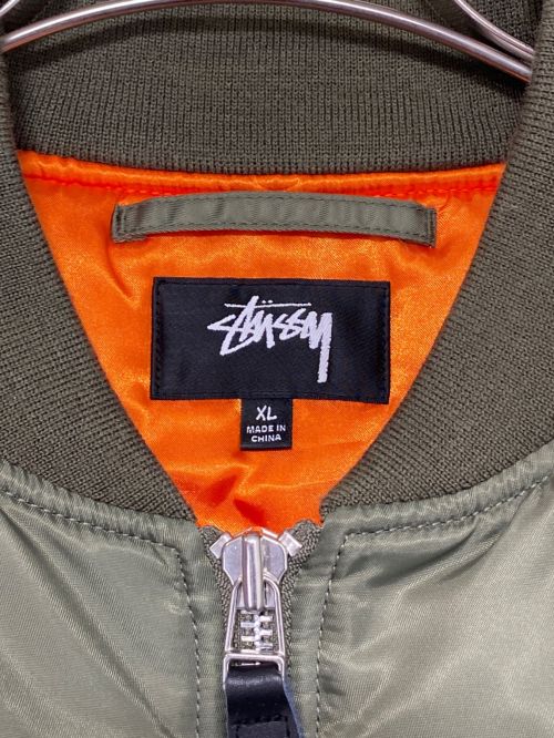 stussy（ステューシー）stussy (ステューシー) COMME des GARCONS (コムデギャルソン) 40th Anniversary CDG MA-1 Jacket カーキ サイズ:XLの古着・服飾アイテム