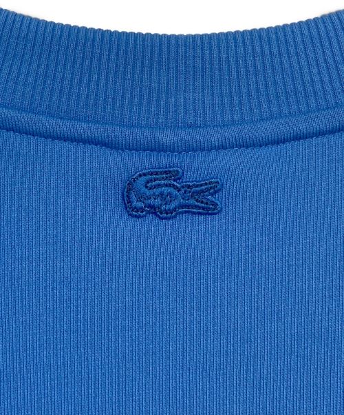LACOSTE（ラコステ）LACOSTE (ラコステ) NETFLIX (ネットフリックス) アレンジワニロゴクルーネックスウェット スカイブルー サイズ:SIZE 4の古着・服飾アイテム