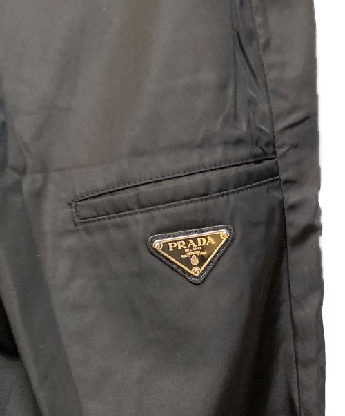 PRADA（プラダ）PRADA (プラダ) ロゴプレートナイロンパンツ ブラック サイズ:48の古着・服飾アイテム