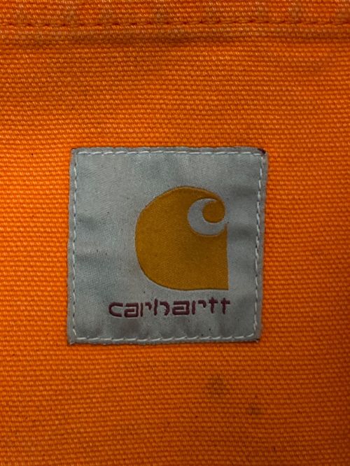 HERON PRESTON（ヘロンプレストン）HERON PRESTON (ヘロンプレストン) Carhartt WIP (カーハート ワークインプログレス) ペイント加工 ワークジャケット オレンジ サイズ:Mの古着・服飾アイテム