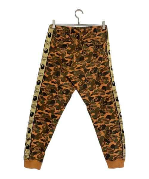 A BATHING APE（ア ベイシング エイプ）A BATHING APE (ア ベイシング エイプ) MCM (エムシーエム) Camo Slim Sweat Pants オレンジ サイズ:Sの古着・服飾アイテム